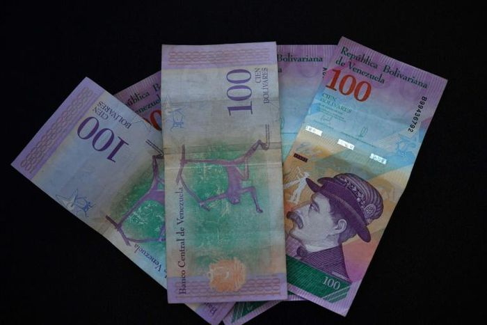 Venezuelan bank notes: the government has devalued the bolivar by nearly 35 percent