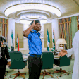 The new Inspector-General of Police (IGP), Mohammad Adamu salutes President Buhari as the outgoing IG, Ibrahim idris watches (Channels TV)