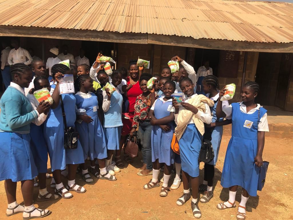 Omu and the students she distributed pads to in Jos, Plateau State. (Karo Omu/Pulse)
