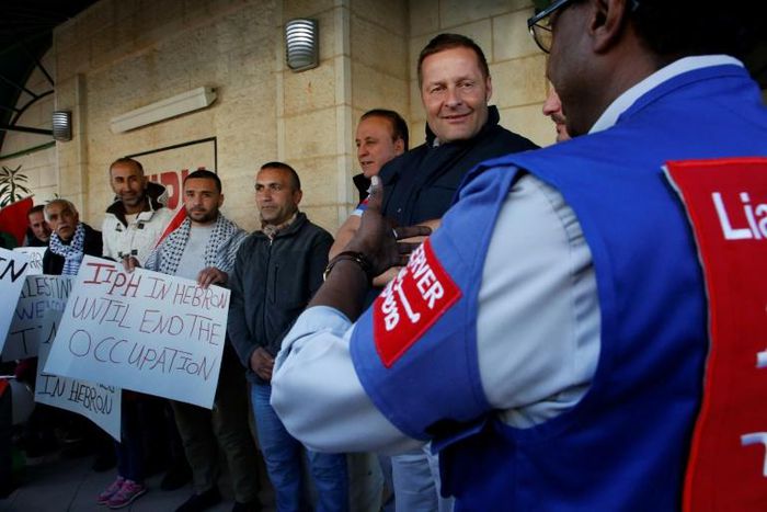Members of the Temporary International Presence in Hebron (TIPH), pictured here with activists in January 2019, established the group following a massacre of Palestinians in 1994