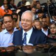 Former PR guru Paul Stadlen was known for staunchly defending Najib Razak (C) even as corruption allegations against him multiplied
