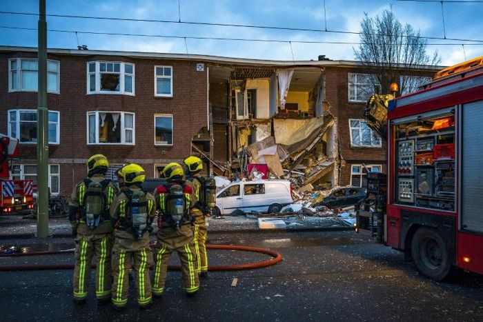 Firefighters rescued three people from the rubble of the house and were working to free a fourth