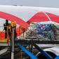 Workers unload food and medical aid from a Boeing 767 aircraft on Curacao, a sleepy island that has become the focus of a tense bid to bring aid by sea to Venezuela