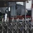 North Korean official Kim Yong Chol is hidden by umbrellas as he arrives at Beijing airport on his way to Washington