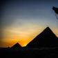 A camel walks past the pyramid of Khafre (also known as Chephren) at the Giza pyramids necropolis on the southwestern outskirts of the Egyptian capital Cairo