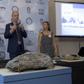 The director of Brazil's National Museum Alexander Kellner (C) shows fossils found in the debris of the institution, gutted by a fire last year, now part of an exhibition called"When Not Everything Was Ice: New Discoveries in the Antarctic Continent"