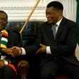 Zimbabwe President Emmerson Mnangagwa, seen here shaking hands with the newly-appointed prosecutor general Kumbirai Hodzi, has pledged to investigate any misconduct by the security forces