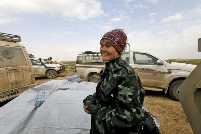 Sahale Eubank, a volunteer with the Free Burma Rangers (FBR), is pictured at a plateau overlooking the embattled Baghouz area in the eastern Syrian province of Deir Ezzor
