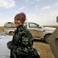 Sahale Eubank, a volunteer with the Free Burma Rangers (FBR), is pictured at a plateau overlooking the embattled Baghouz area in the eastern Syrian province of Deir Ezzor