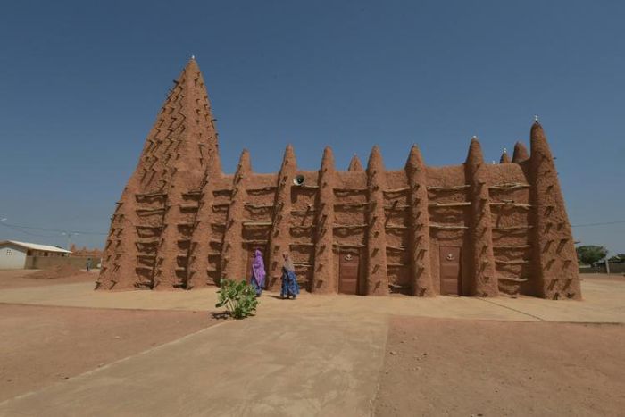 Devotees at one of Kong's two mosques, historic treasures built in the Sudanese style suited to the hot and arid climes of the Sahel