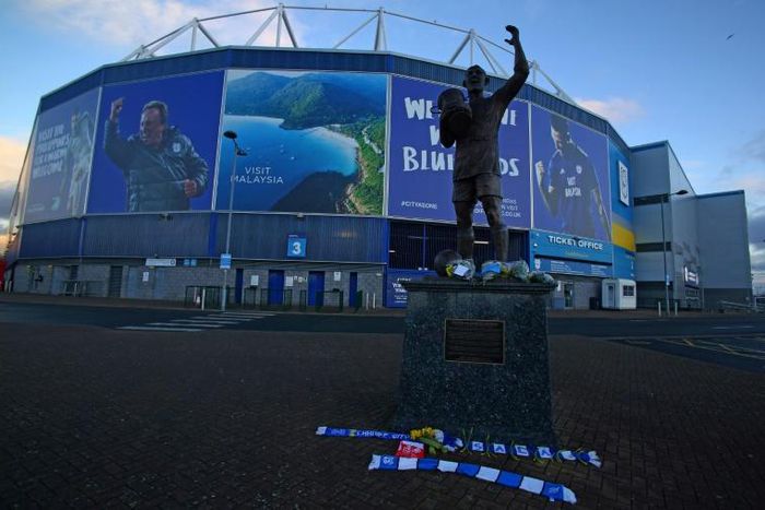 Bunches of daffodils and a scarf are left outside the Cardiff City Stadium with the club's record signing Emiliano Sala feared dead in a plane crash