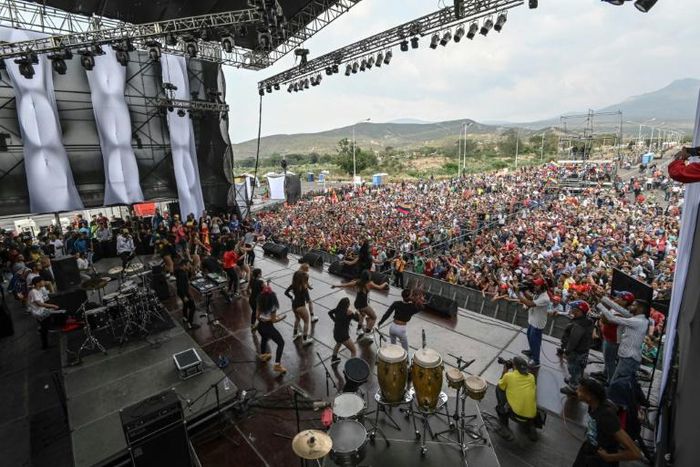 People attend the three-day pro-regime concert called by Venezuela President Nicolas Maduro to rival a charity music festival organized by British entrepreneur Richard Branson, on the Venezuelan side of the Tienditas International Bridge