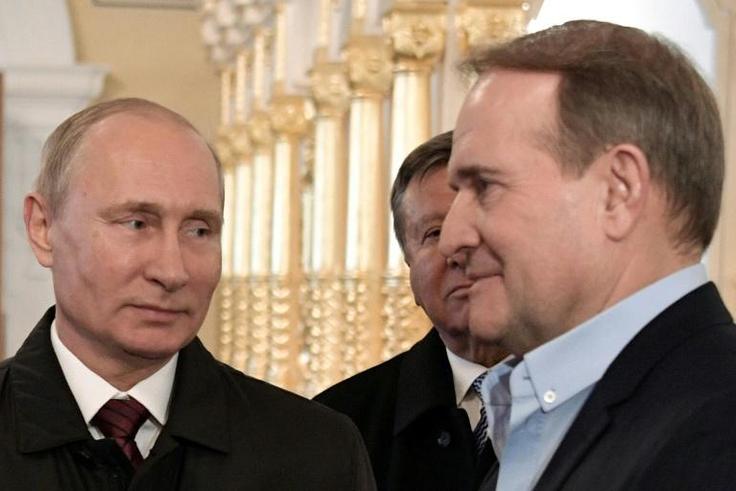 Russian President Vladimir Putin (L) and Ukrainian politician Viktor Medvedchuk visit the New Jerusalem Orthodox Monastery outside the town of Istra, some 70 km outside Moscow, on November 15, 2017
