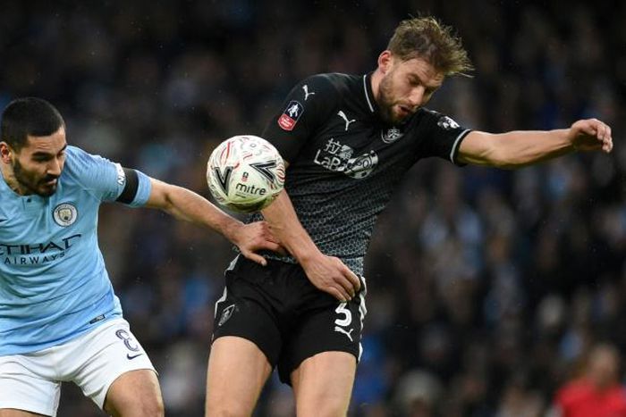 Manchester City midfielder Ilkay Gundogan (L), in action against Burnley last month, has won titles under both Jurgen Klopp and Pep Guardiola