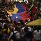Tens of thousands have protested across Venezuela in rival demonstrations for and against Maduro