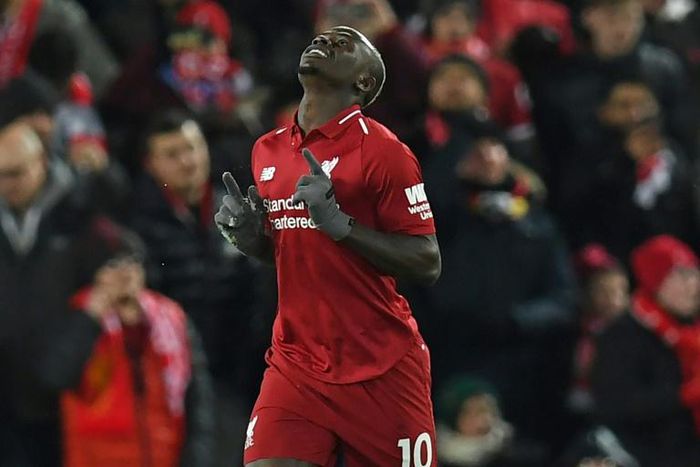 Sadio Mane celebrates after giving Premier League leaders Liverpool an early lead in an eventual 1-1 draw with Leicester at Anfield