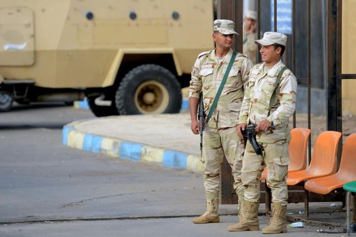 Egyptian conscripts stand guard after a bomb and gun assault on a North Sinai mosque in November 2017 killed more than 300 people and triggered a major offensive against the jihadists