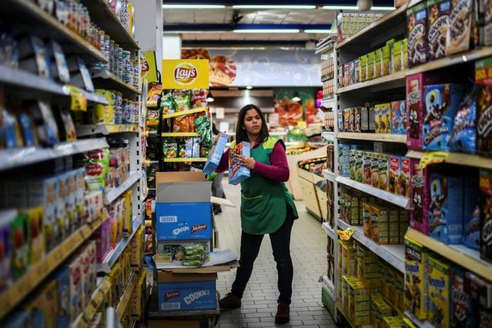 Doctor to shelf-stacker -- Dihara Ramirez left Venezuela for a new life in Portugal