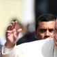 Pope Francis waves after a meeting with Central American bishops in which he blasted "fears and suspicions" over migration