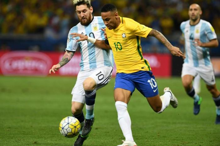 Argentina's Lionel Messi (left) and Brazil's Neymar challenge for the ball in a World Cup qualifier in 2016