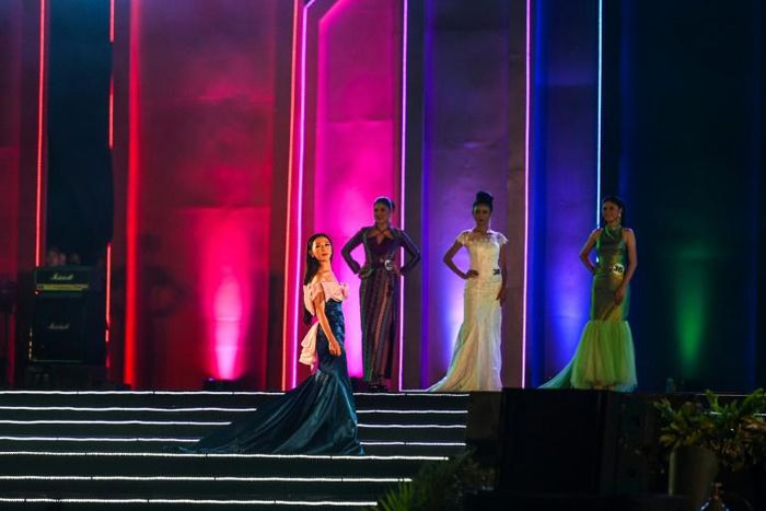 Female contestants sashayed across the stage in Yangon in front of thousands, displaying an array of kaleidoscopic costumes