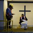 Funeral home employees in Guatemala prepare the coffin holding the repatriated body of eight-year-old migrant Felipe Gomez