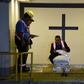 Funeral home employees in Guatemala prepare the coffin holding the repatriated body of eight-year-old migrant Felipe Gomez