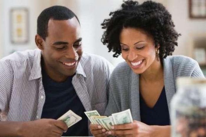 a couple counting money