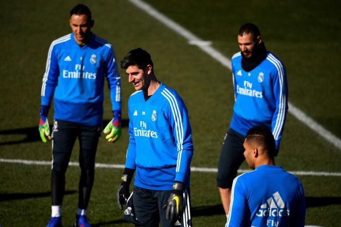 Cold comfort: Real Madrid goalkeeper Thibaut Courtois could face anger from Atletico fans on Saturday