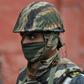 A memeber of the Indian Central Reserve Police Force (CRPF) stands guard in Srinagar on August 15, 2012