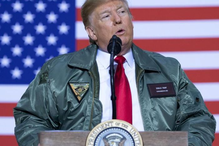 President Donald Trump addresses US troops in Iraq during a lightning surprise visit to Al-Asad Air Base on December 26, 2018