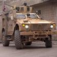 US armored vehicles at the scene of a suicide attack in the northern Syrian town of Manbij, where a suicide bomber killed 19 people including four Americans on January 16, 2019