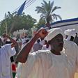 Sudanese protesters shout slogans against the government after prayers at a mosque in Khartoum's twin city Omdurman
