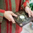 A luopan, or Chinese compass, is used by Chinese feng shui masters to find the right alignment to promote health and wealth