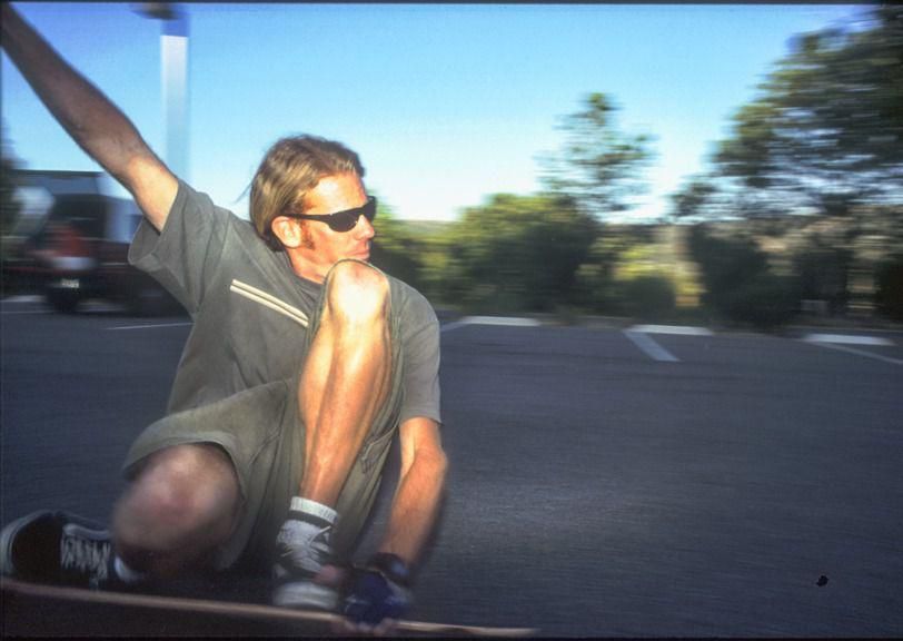The author leaning into a downhill run on a Sector 9 pintail, San Clemente, California, 1999 or so.