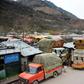 Trucks jam the road in border town of Chakothi in Pakistan-administered Kashmir, where bunkers are being rebuilt and a blackout ordered since a deadly attack sent tensions with neighbouring India soaring