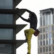 Alain Robert, dubbed the 'French spiderman' climbed the 47-storey GT Tower without safety equipment