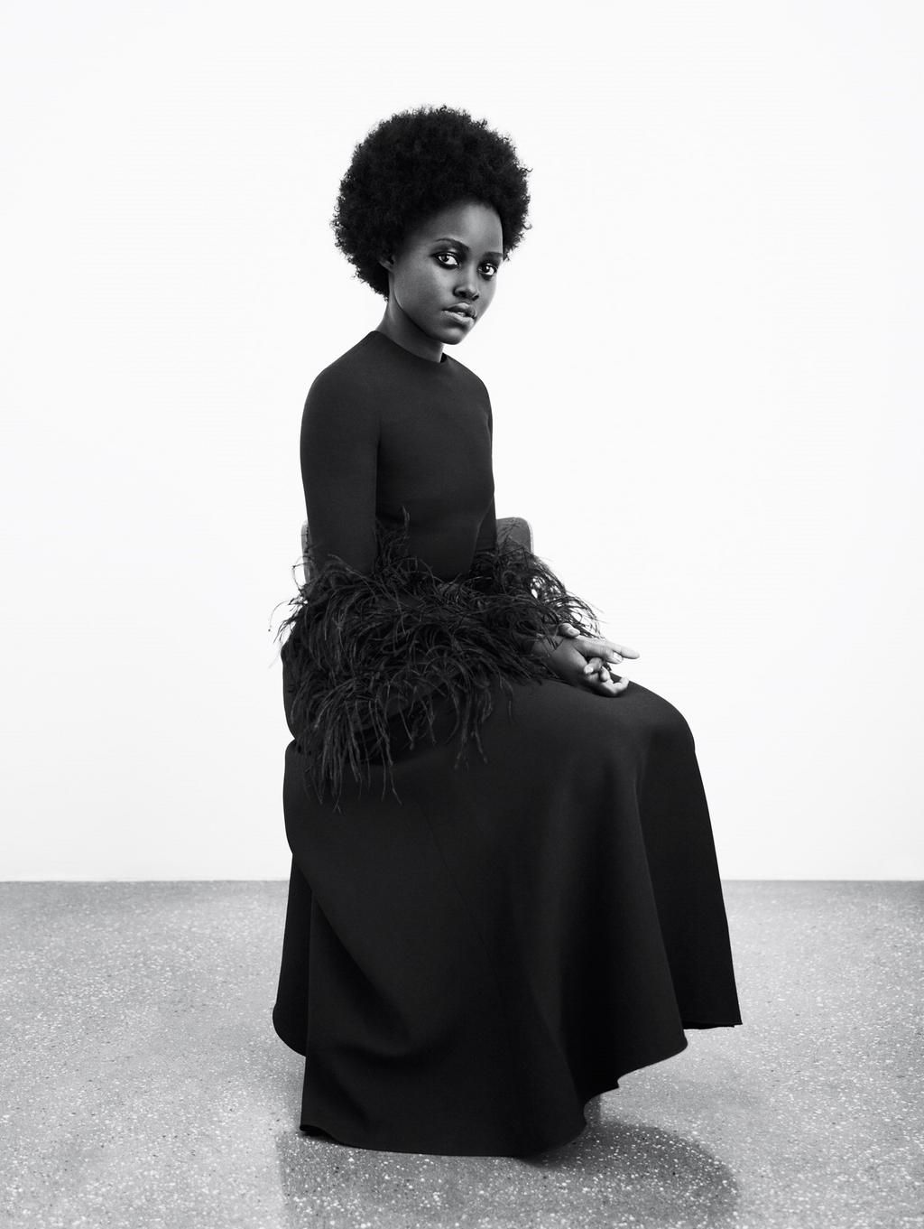 Lupita poses in a black Valentino dress for Another magazine