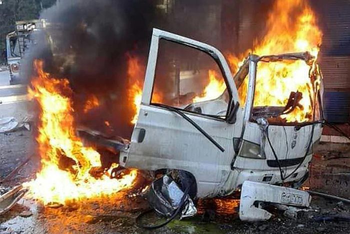 This handout picture made available by Syria's official news agency SANA on January 22, 2019, shows a burning vehicle in the Syrian regime's coastal stronghold of Latakia