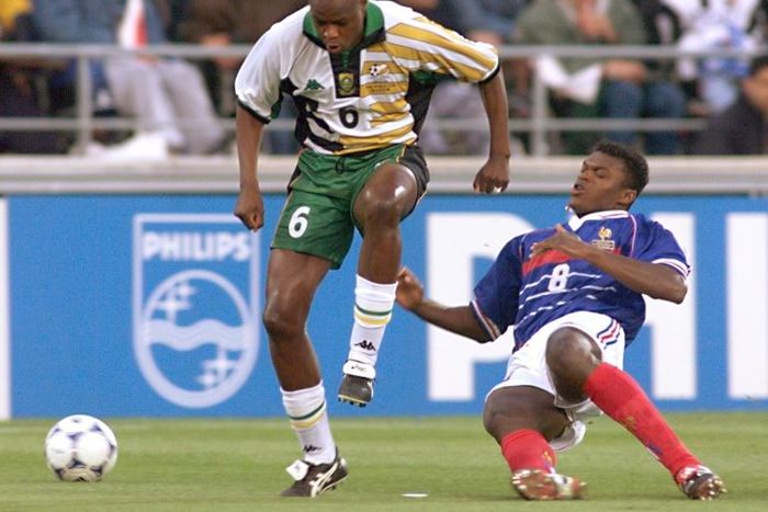 Marcel Desailly of France tackles Philemon Masinga (L) of South Africa during a 1998 World Cup group match in Marseille