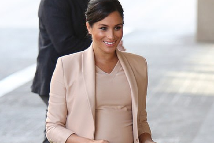 Meghan Markle's pregnancy glow is unreal as she steps out in a pretty peach outfit