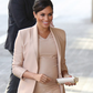 Meghan Markle's pregnancy glow is unreal as she steps out in a pretty peach outfit