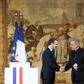 French President Emannuel Macron shakes hands with Apostolic Nuncio to France Luigi Ventura who is being investigated for sexual assault
