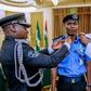 Mohammad Adamu (middle) decorated by Idris Ibrahim (left) and President Muhammadu Buhari (right) as the new Inspector-General of Police [Twitter/@NGRPresident]
