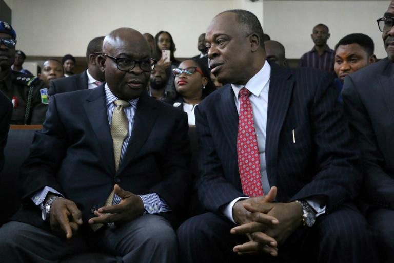 Nigeria's top judge Walter Onnoghen, seen on the left, has been put on trial for failing to disclose assets in what many see as a politically-charged case ahead of the elections