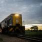 The commuter train known as the 'Freedom Train' nears a station in Cowdray Park township, Bulawayo, as dawn light rises on a late January day