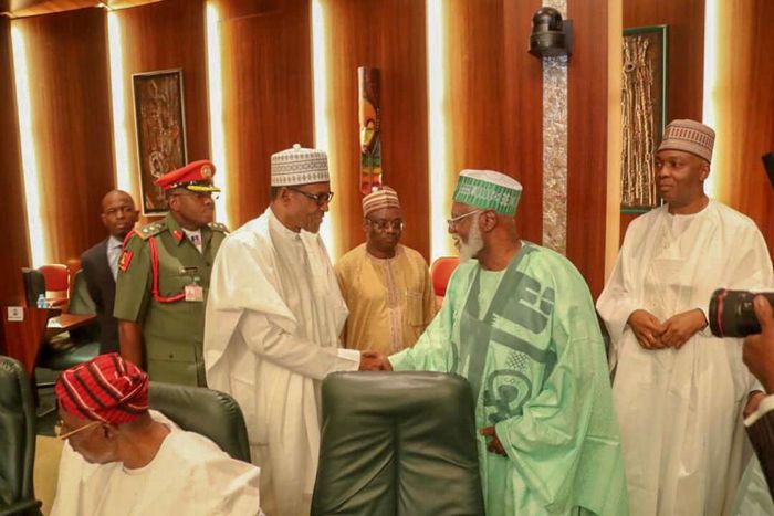 President Muhammadu Buhari shakes hands with former Head of State, Abdulsalami Abubakar, with Senate President, Bukola Saraki in the background at the National Council of State meeting that held in the Presidential Villa on January 22, 2019