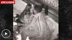 Tristan Thompson at lounge with 2 women making out