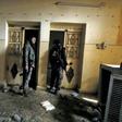 A fighter from the Syrian Democratic Forces (SDF) walks inside a former Islamic State (IS) group prison in the city of Hajin, the last remaining IS pocket in Syria