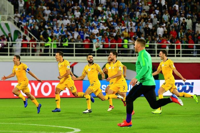 Australia's players celebrate their shoot out victory over Uzbekistan